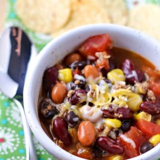 taco soup in a white bowl with spoon