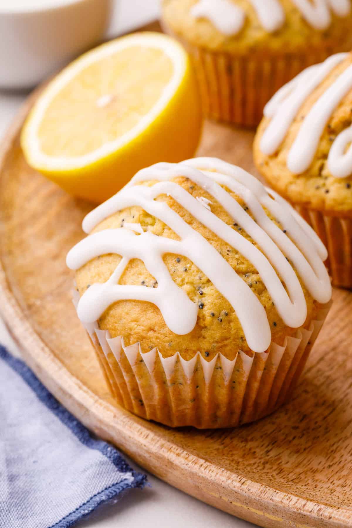 close up on lemon poppy seed muffin topped with glaze