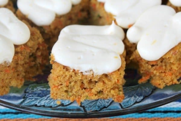 Looking for a way to use up all those zucchini that are popping up - try these quick and easy Zucchini Carrot Bars with Lemon Cream Cheese Frosting today!