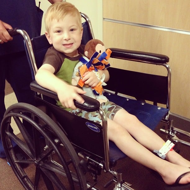 child in wheelchair after having tonsils removed 
