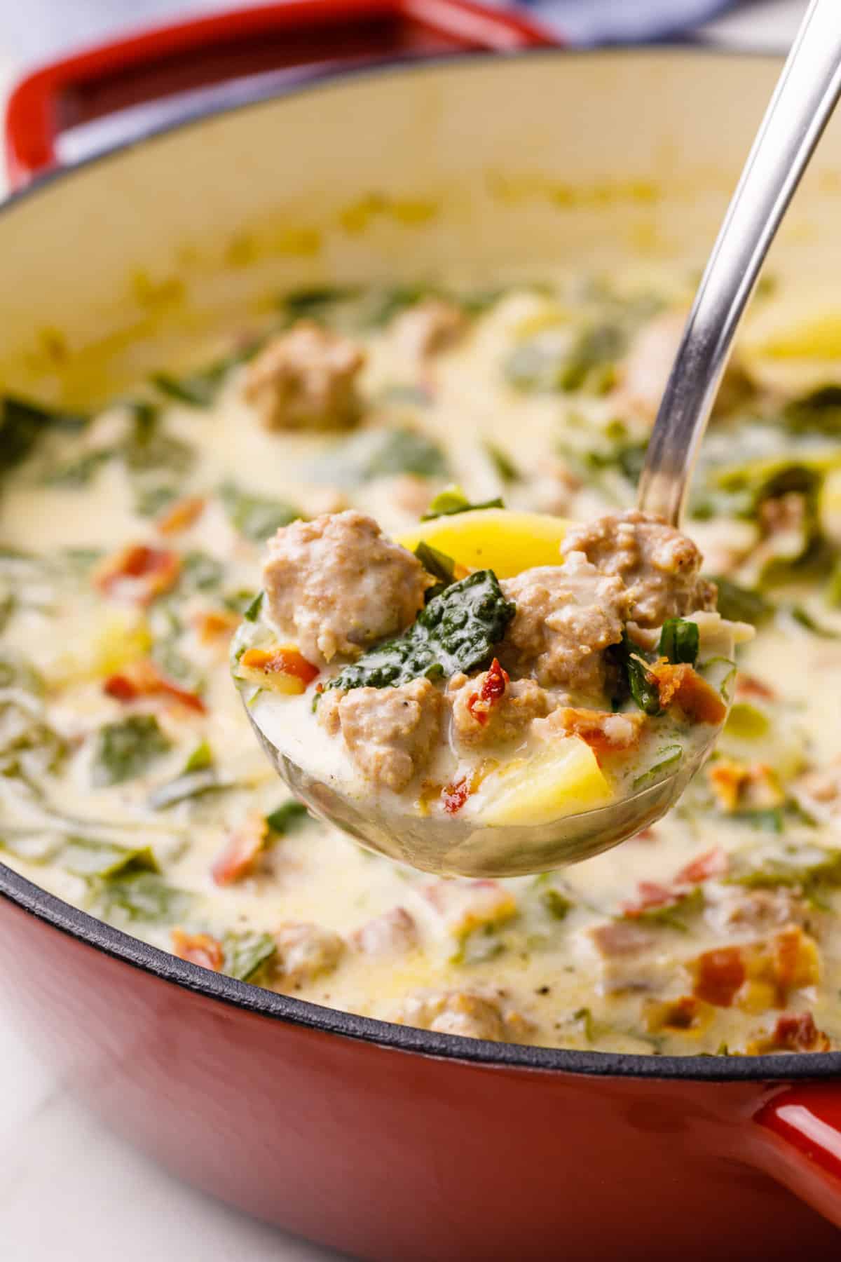 ladle full of olive garden zuppa toscana soup