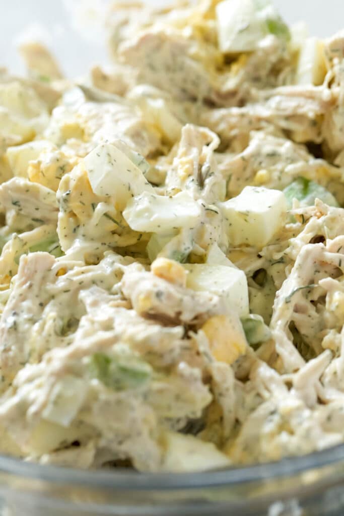 Close up egg salad in a bowl.