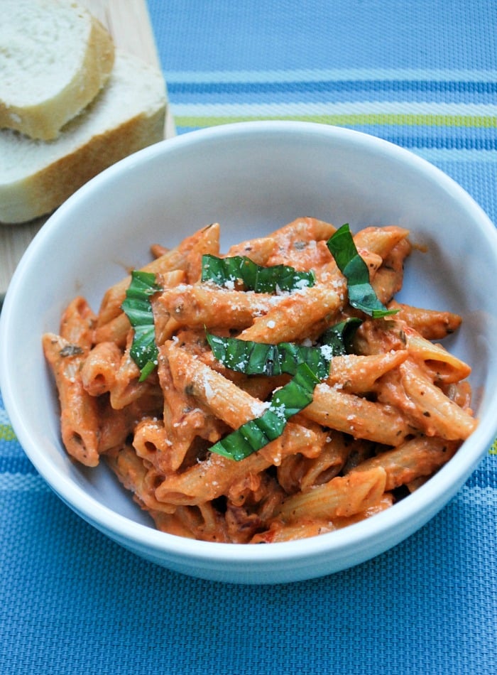Creamy Tomato and Basil Penne Pasta in a white bowl 