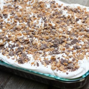 A doctored up cake mix and other store bought ingredients makes this Heath Bar Cake super easy to make and a complete hit every time!
