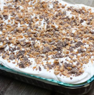 A doctored up cake mix and other store bought ingredients makes this Heath Bar Cake super easy to make and a complete hit every time!