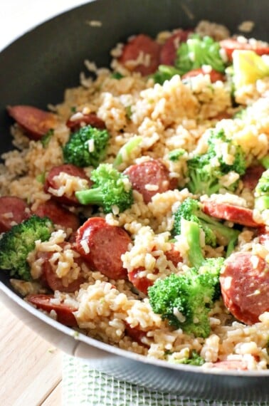This quick & easy Smoked Sausage & Rice One Skillet Meal Recipe can be made in under 30 minutes and promises to be a hit around your dinner table!