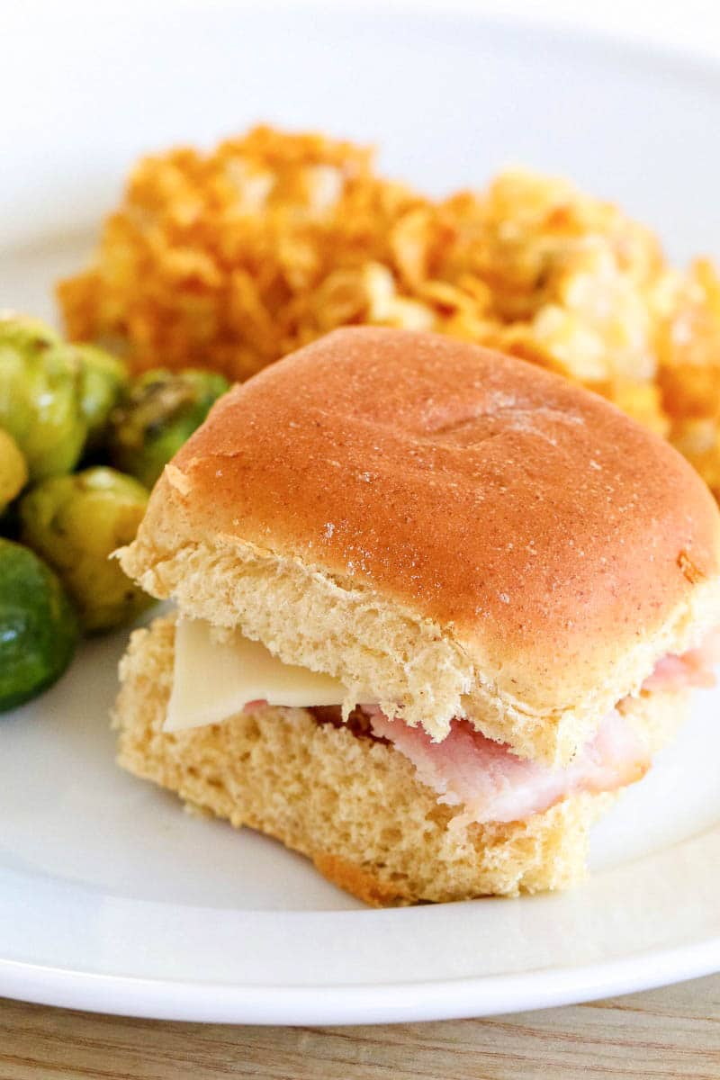 bread roll with ham and sides.