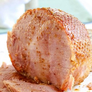 Crock Pot Ham with two pieces sliced.