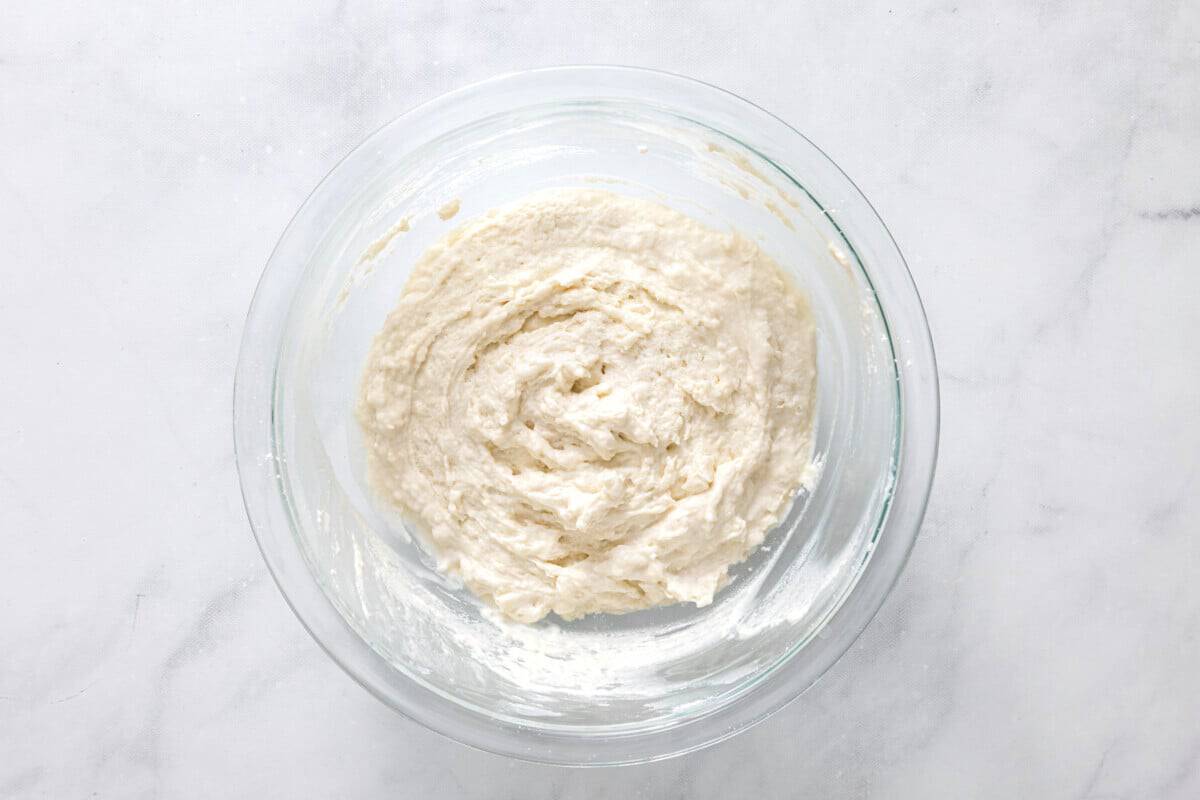 Biscuit dough in glass bowl.