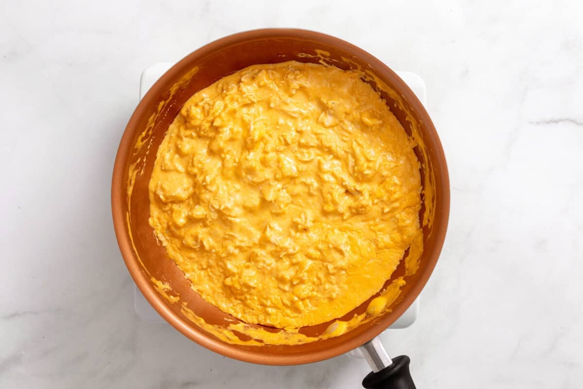 Filling for buffalo chicken sandwiches in skillet.