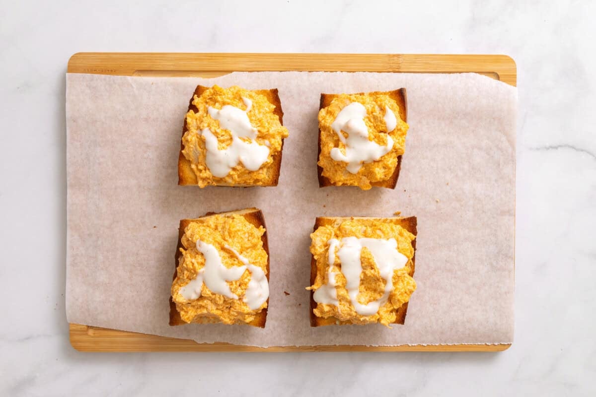 Buffalo chicken sandwiches topped with blue cheese dressing.