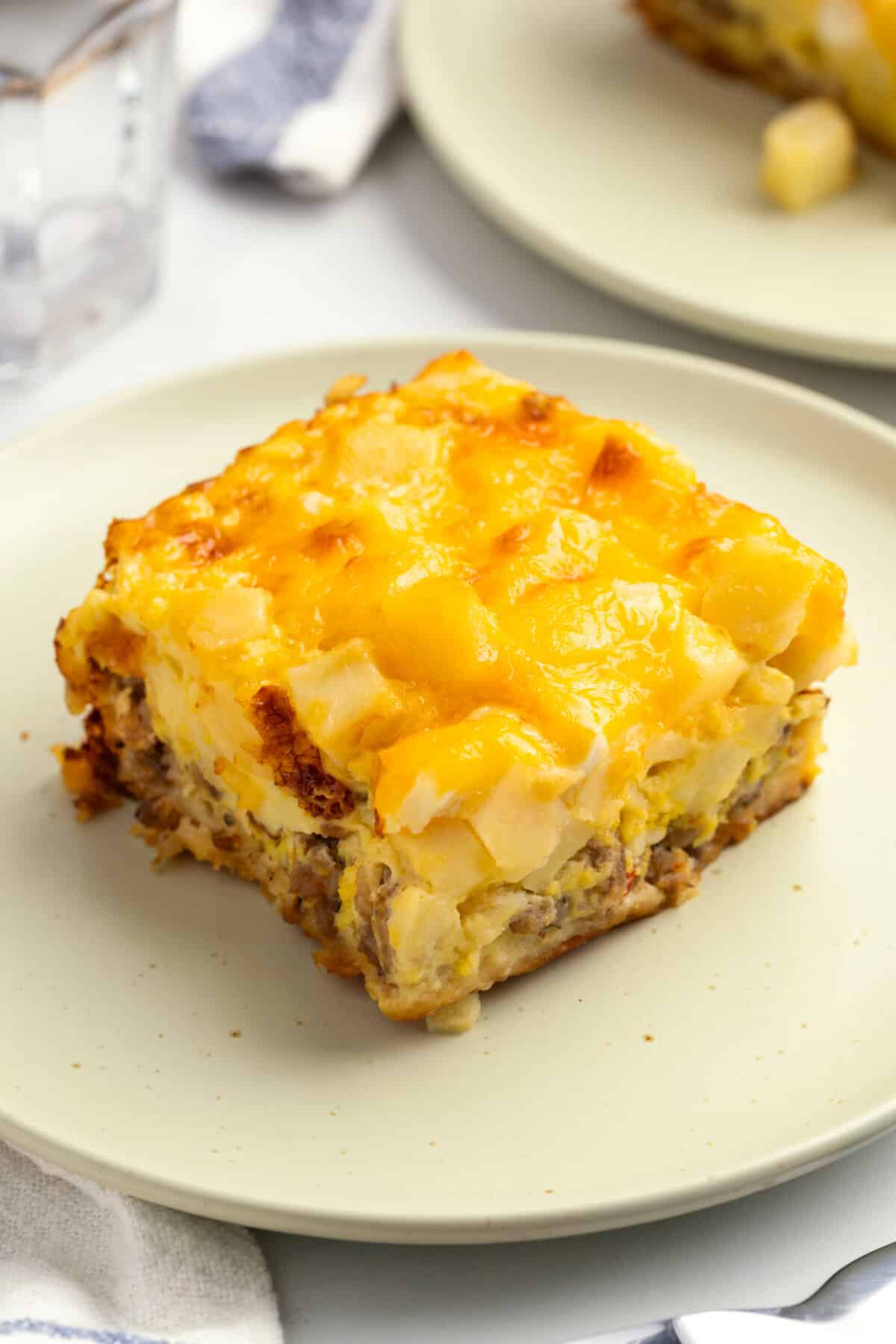 Square of overnight breakfast casserole on plate.