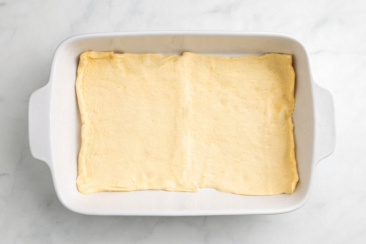 Crescent dough in casserole dish.