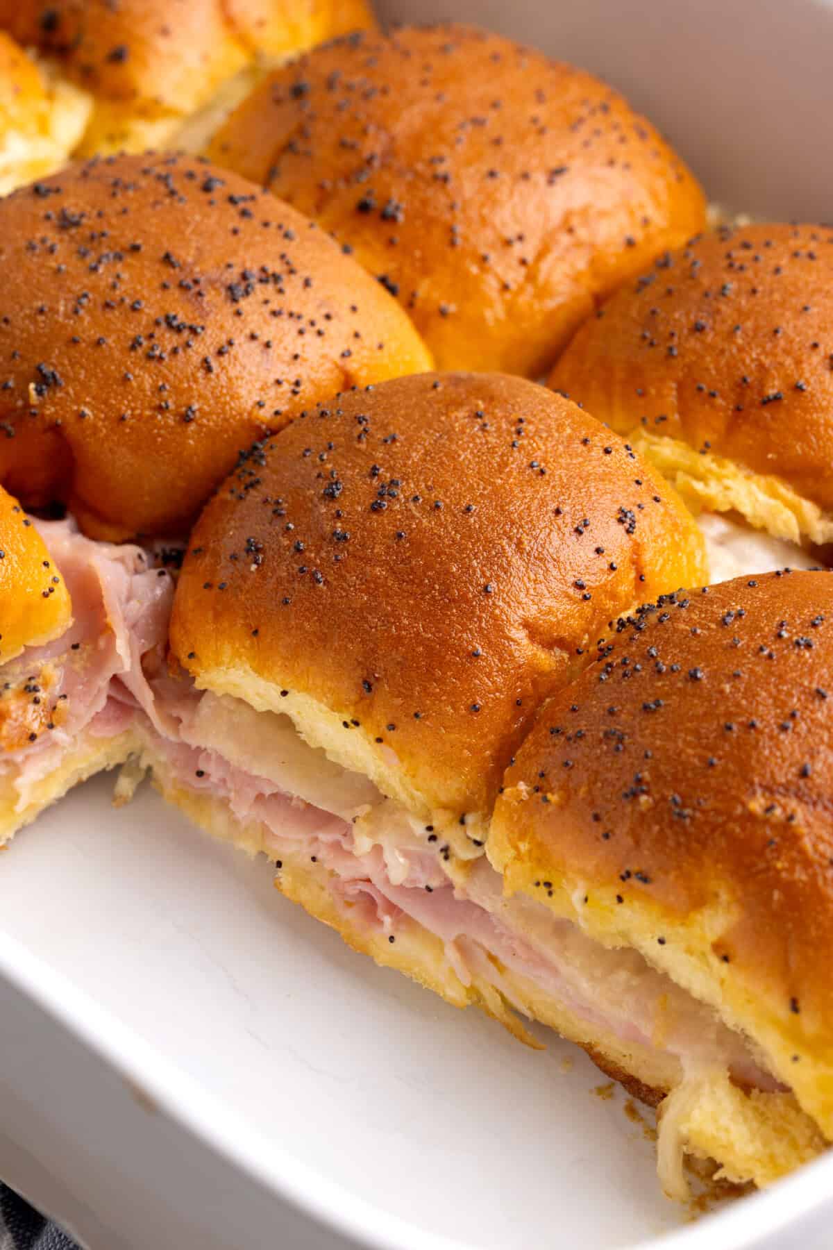 Ham and Swiss sliders in baking dish.