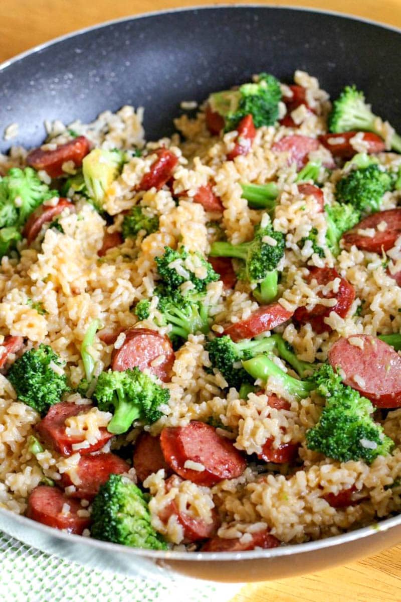 sausage recipe in a skillet with rice and vegetables 