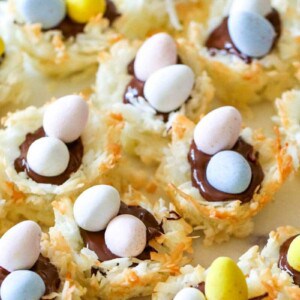 You're gonna love these Coconut Macaroon Nests that are filled with dark chocolate and topped with Mini Cadbury Eggs because they are the perfect Easter treat! #macaroons #coconut #cookies #easter #dessert #allthingsmamma | allthingsmamma.com