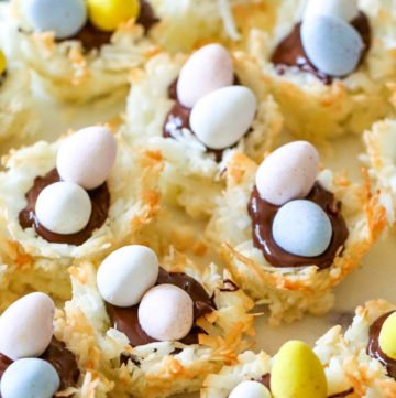 You're gonna love these Coconut Macaroon Nests that are filled with dark chocolate and topped with Mini Cadbury Eggs because they are the perfect Easter treat!  #macaroons #coconut #cookies #easter #dessert #allthingsmamma | allthingsmamma.com