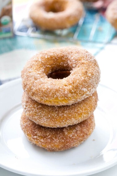 These Baked Pumpkin Spice Donuts, topped with cinnamon-sugar, are the ultimate easy fall dessert! #pumpkin #dessert #donuts #falldessert | allthingsmamma.com