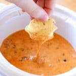 With only 2-ingredients, this Chili Cheese Dip is always a hit! Make this quick & easy appetizer in the slow cooker or microwave for a crowd-pleasing dip!