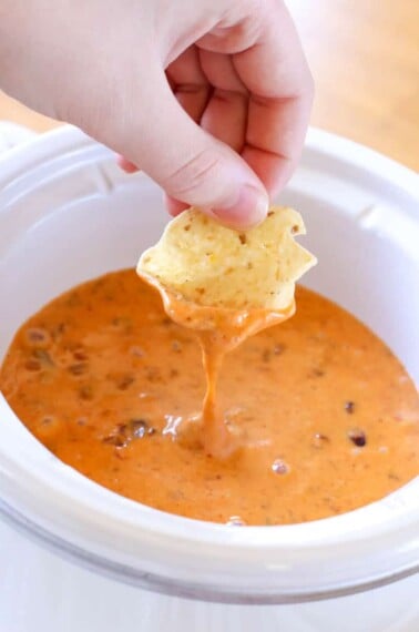 With only 2-ingredients, this Chili Cheese Dip is always a hit! Make this quick & easy appetizer in the slow cooker or microwave for a crowd-pleasing dip!