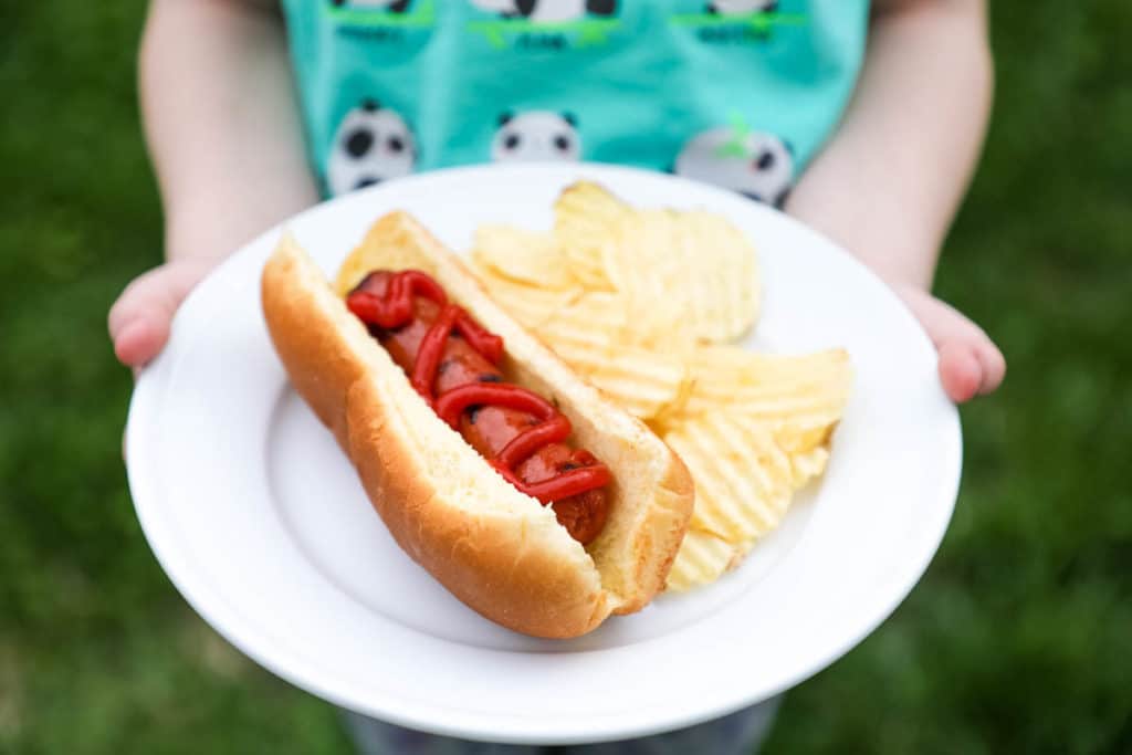 hot dog and chips on a plate 