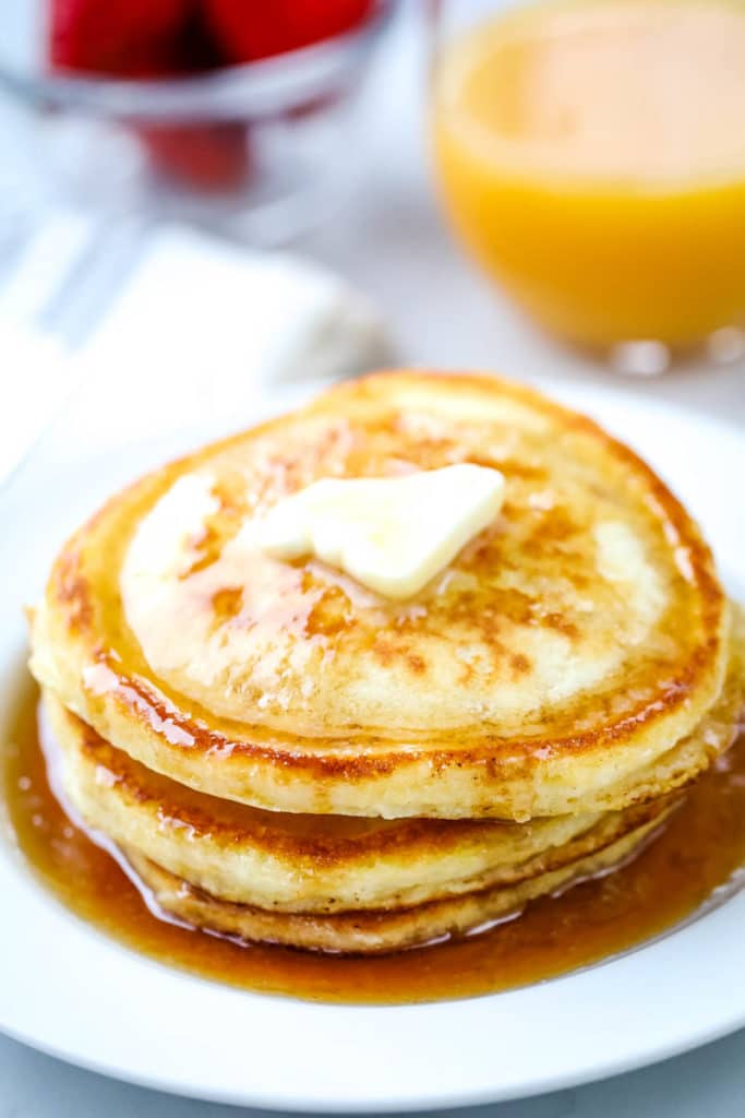 stack of made from scratch pancakes topped with butter 