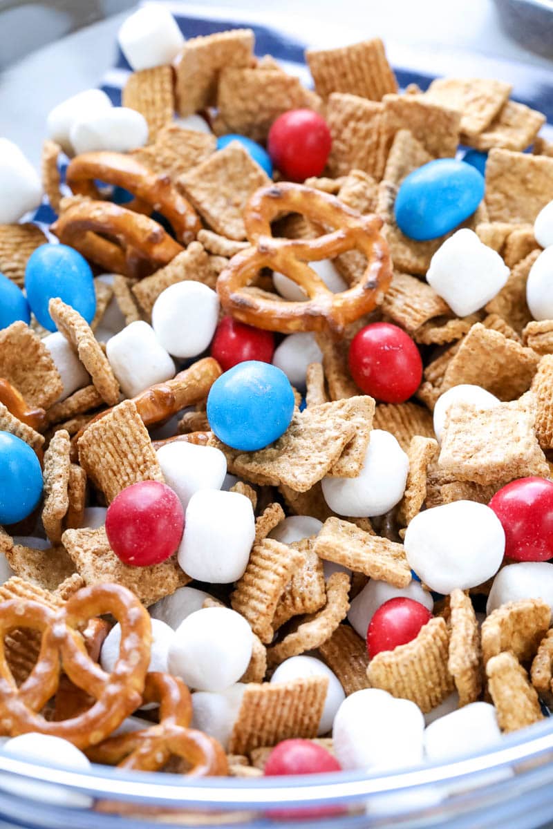 Snack mix in bowl with red white and blue ingredients 