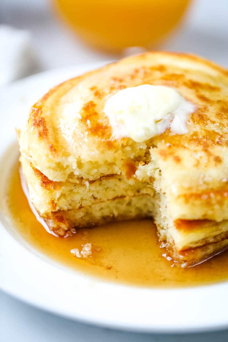 homemade buttery pancakes on a white plate