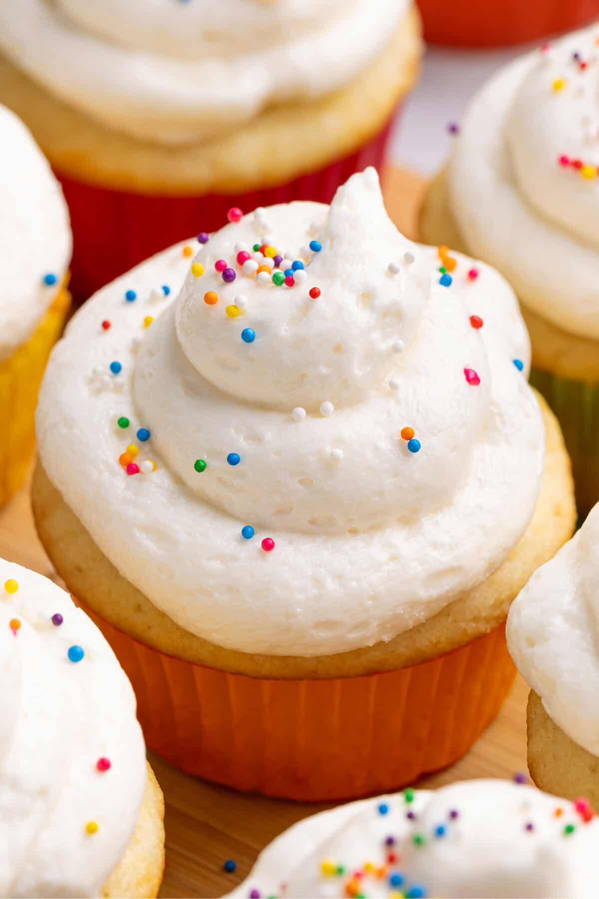Cupcake topped with fluffy buttercream frosting.