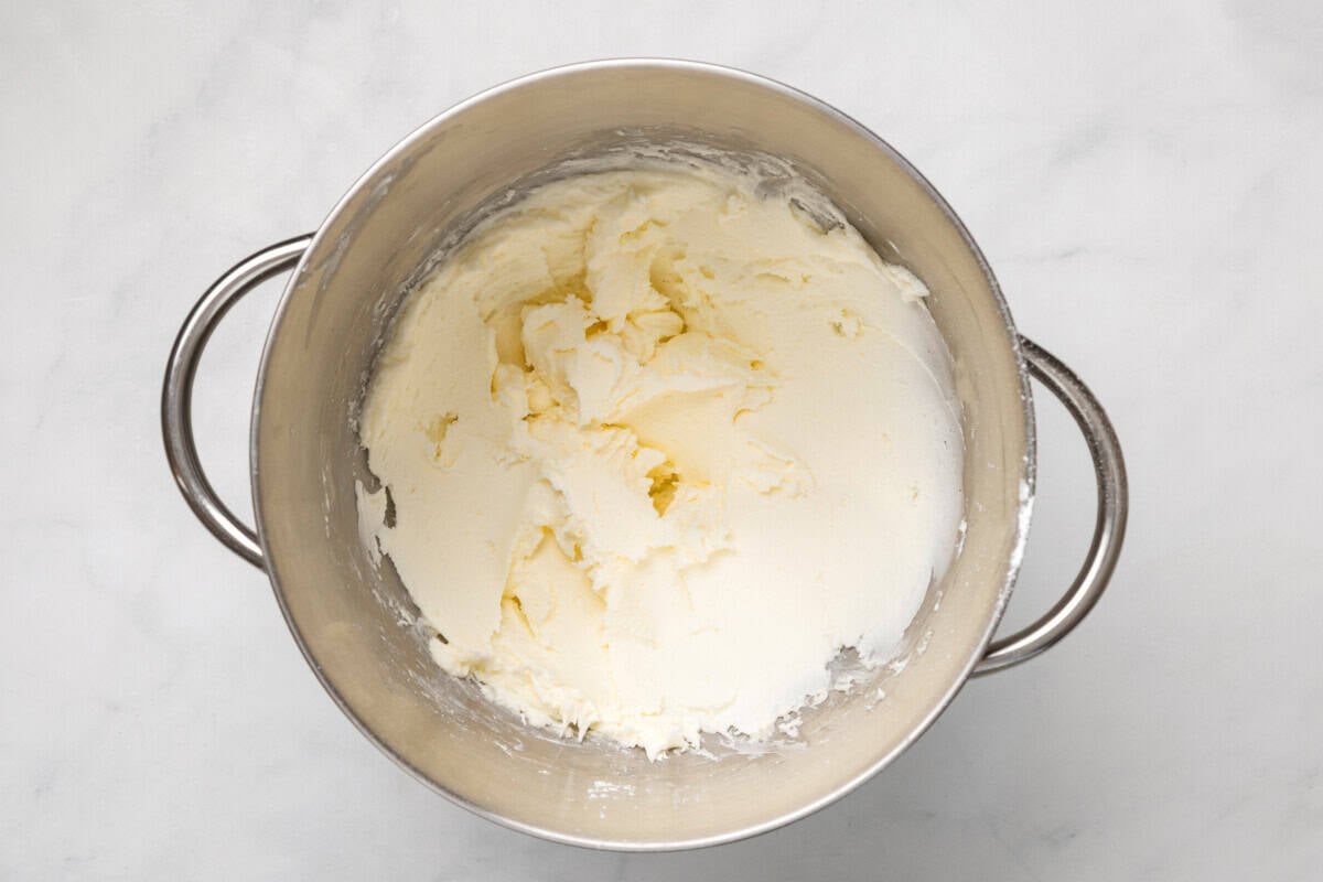 Butter and powdered sugar mixed in bowl.