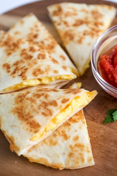 Slices of breakfast quesadilla on a plate.