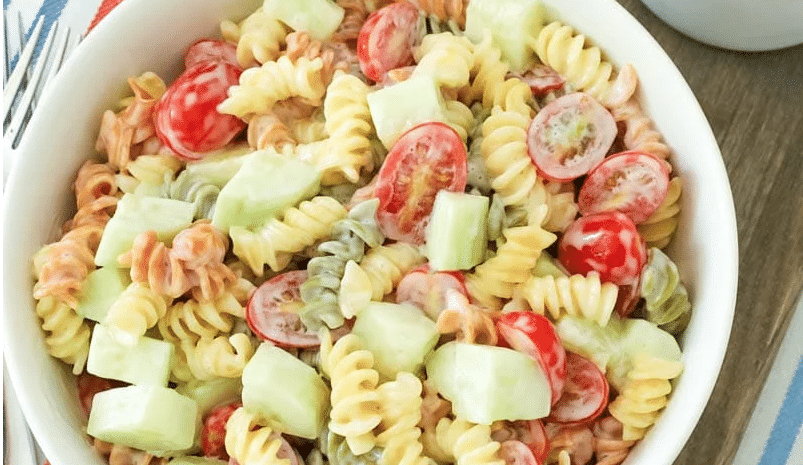 overhead view of pasta salad in a white bowl