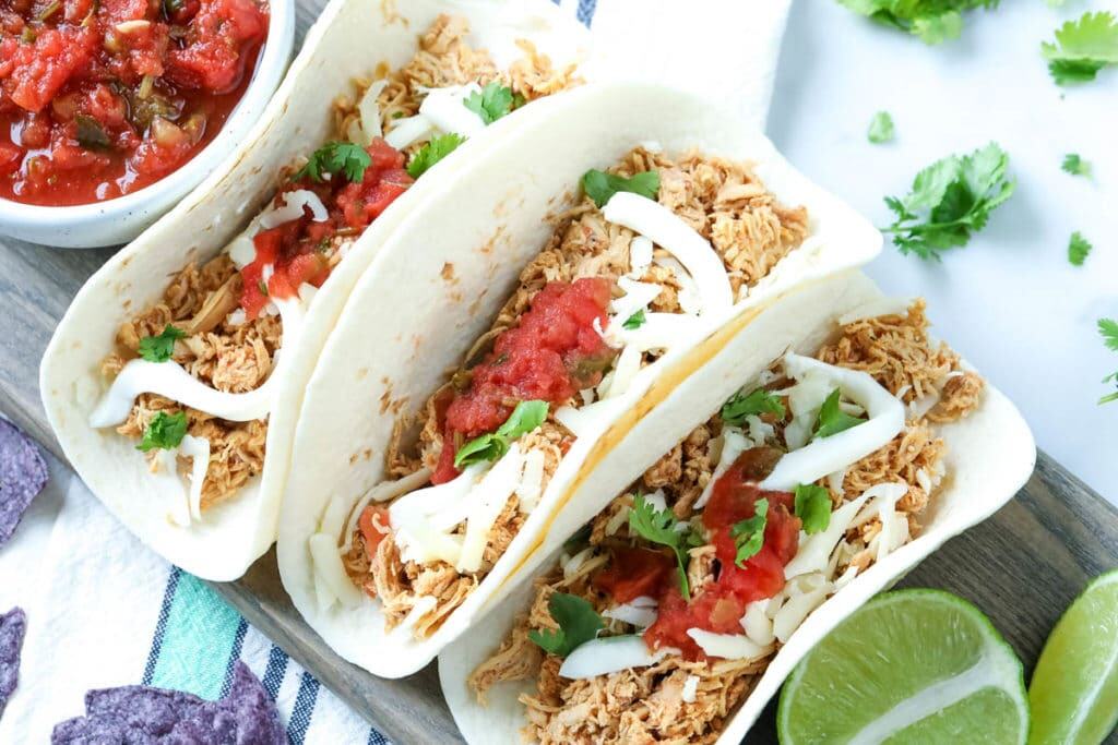 chicken tacos with toppings and salsa