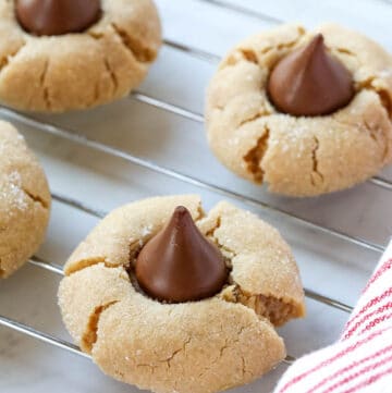 peanut butter kiss cookies on a wire rack.