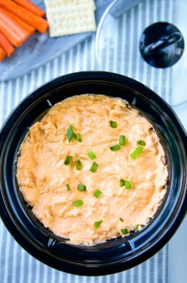 Healthy Buffalo Chicken Dip is a delicious, lighter, no-guilt version of your favorite game-day appetizer! All the flavor of Buffalo Chicken Dip but a skinny version! #buffalochicken #buffalochickendip #dip #appetizer #gamedayappetizer #crockpot #slowcooker