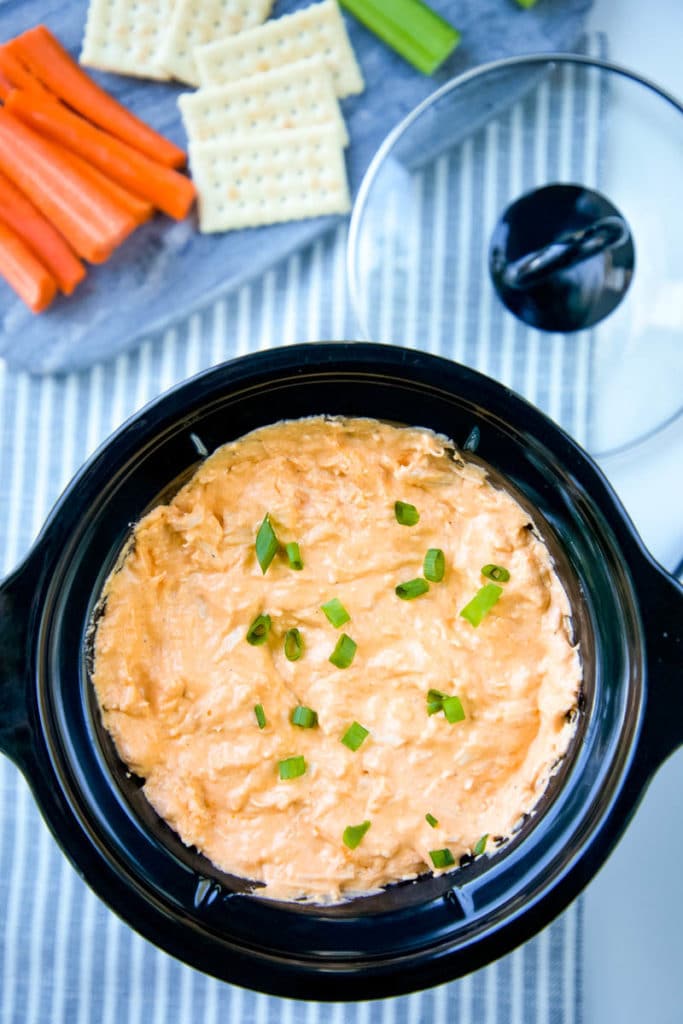 Healthy Buffalo Chicken Dip is a delicious, lighter, no-guilt version of your favorite game-day appetizer! All the flavor of Buffalo Chicken Dip but a skinny version! #buffalochicken #buffalochickendip #dip #appetizer #gamedayappetizer #crockpot #slowcooker