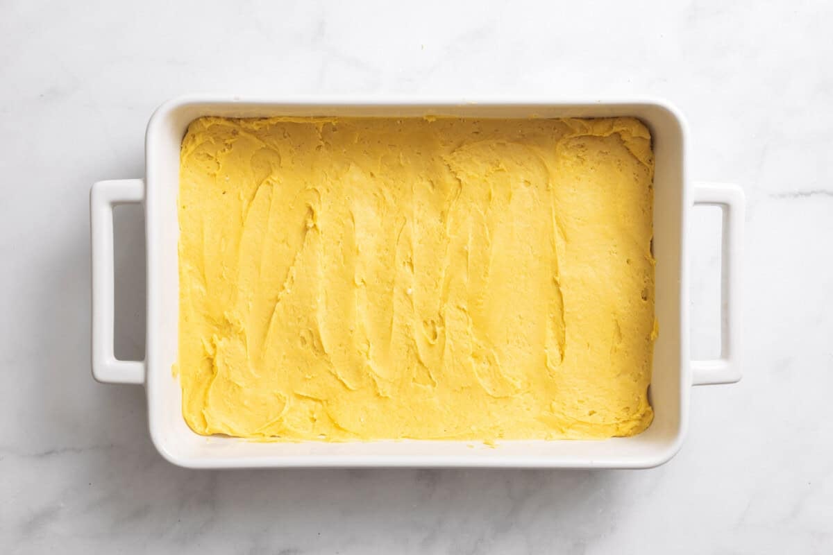 Cake batter spread into bottom of pan.