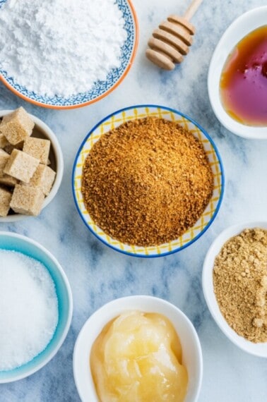 Bowls of different kinds of sweeteners.