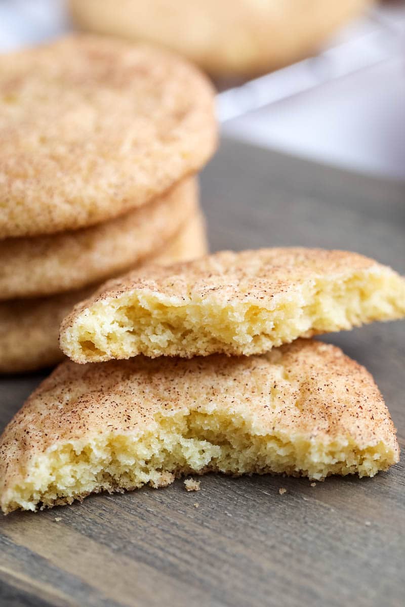 stack of chewy snickerdoodle cookies with a bite taken out 