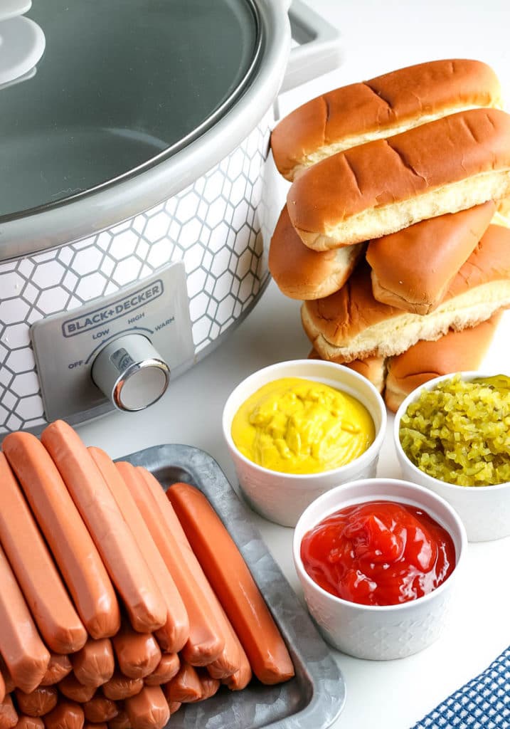 hot dogs that are cooked with buns and toppings 