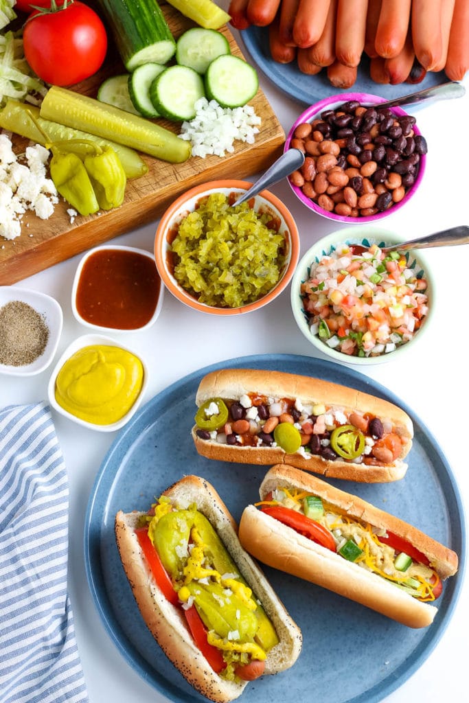 hot dogs in buns with toppings