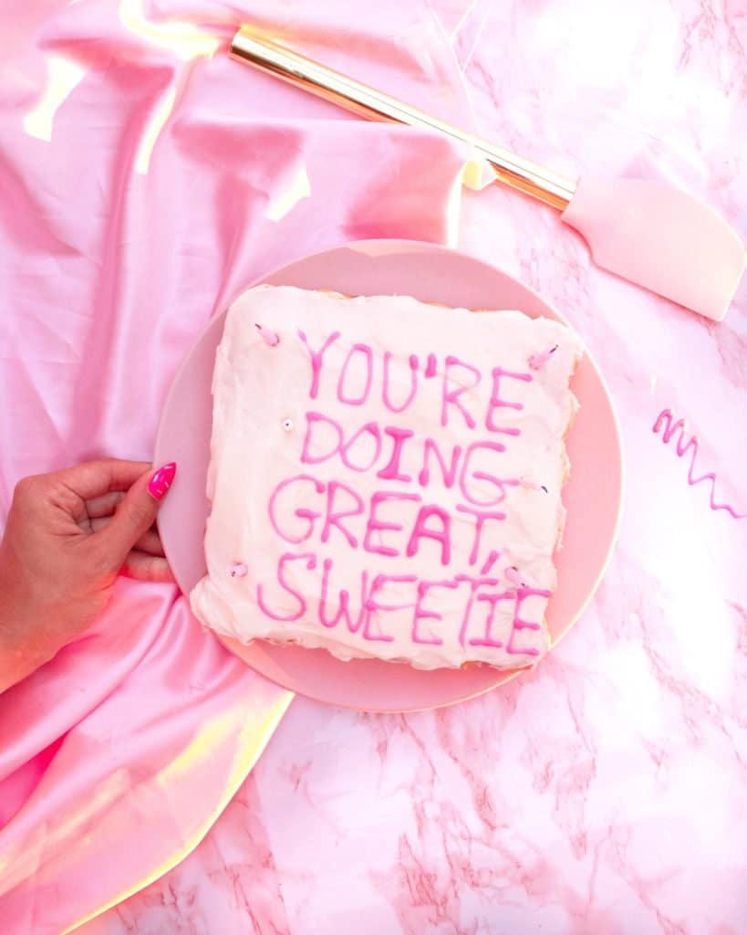 Picture of a piece of cake with text that reads you're doing great sweetie. 