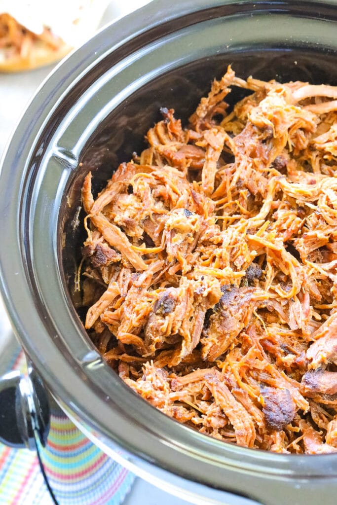 close up of the shredded pork in the crock pot 