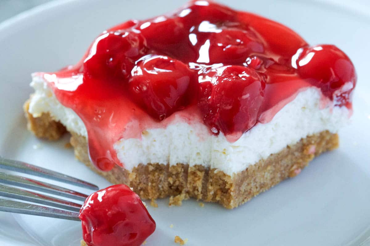 no bake cherry cheesecake missing a corner bite. 