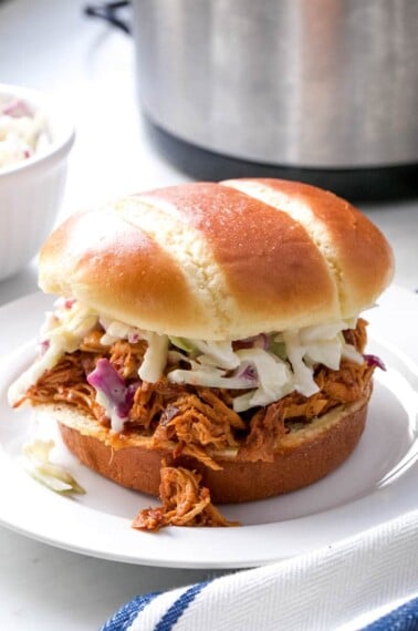 close up of bbq chicken sandwich on a plate