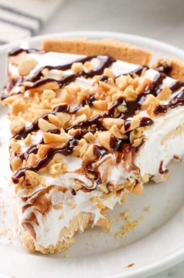 creamy peanut butter pie topped with drizzled fudge
