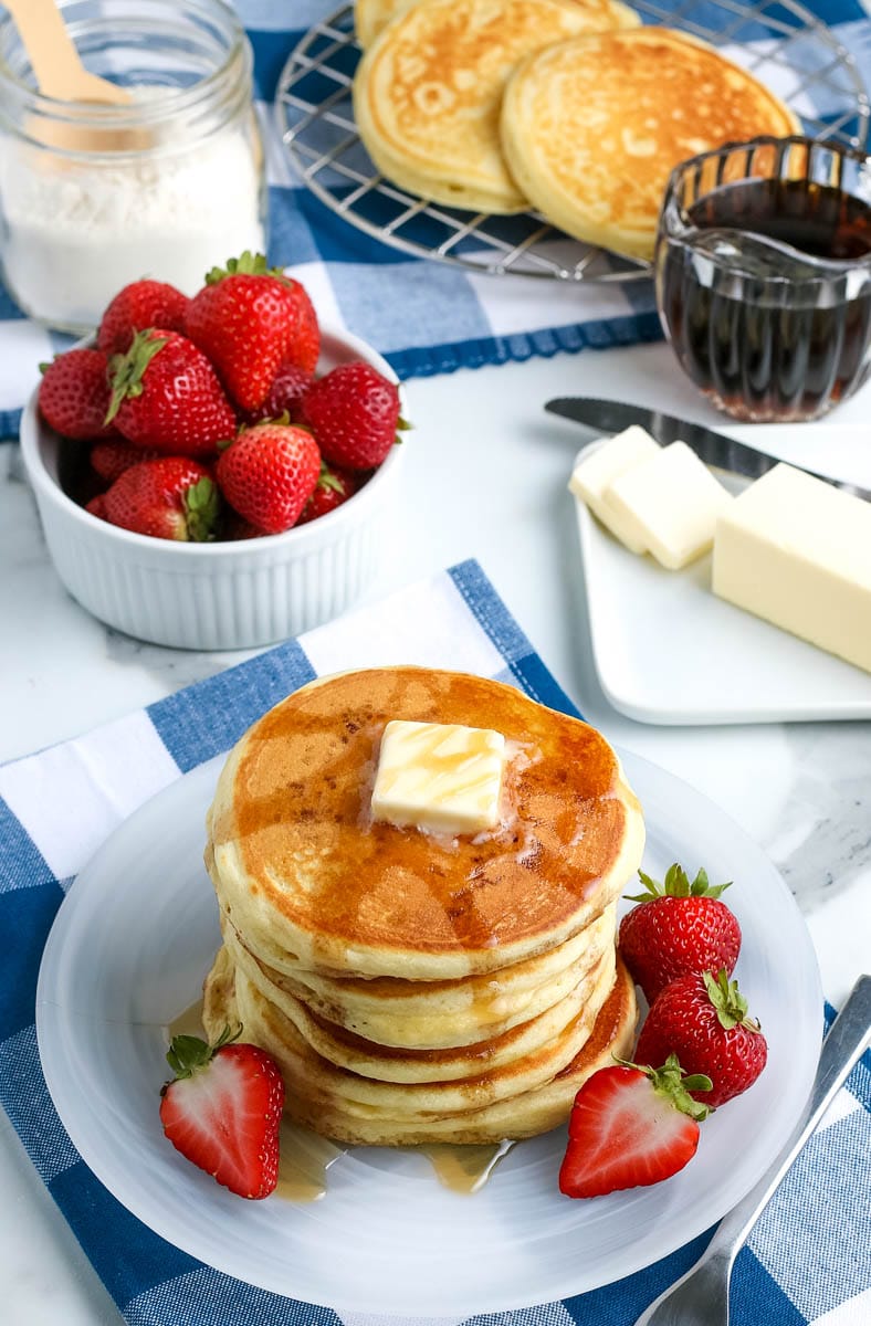 stack of fluffy pancakes on a plate 