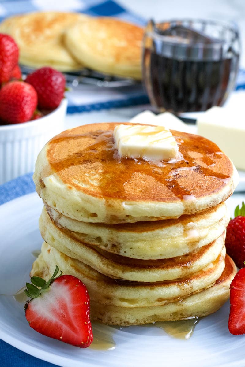 stack of pancakes with butter on top 