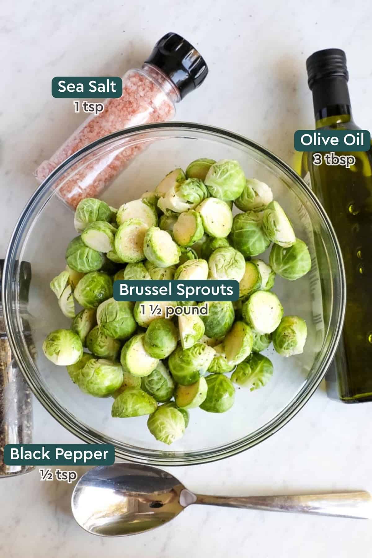 Ingredients for roasted brussels sprouts, including oil, salt, brussels sprouts, and pepper.