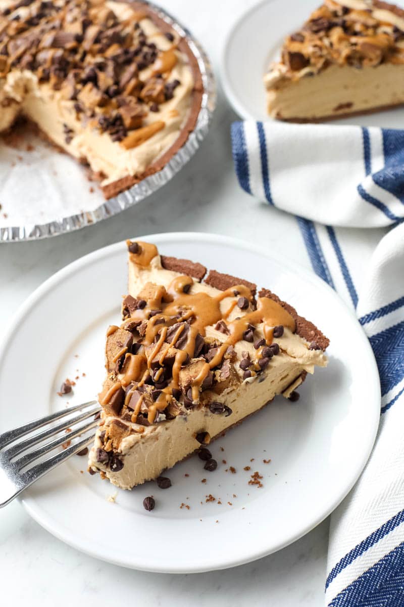 chocolate peanut butter pie sliced on a plate 